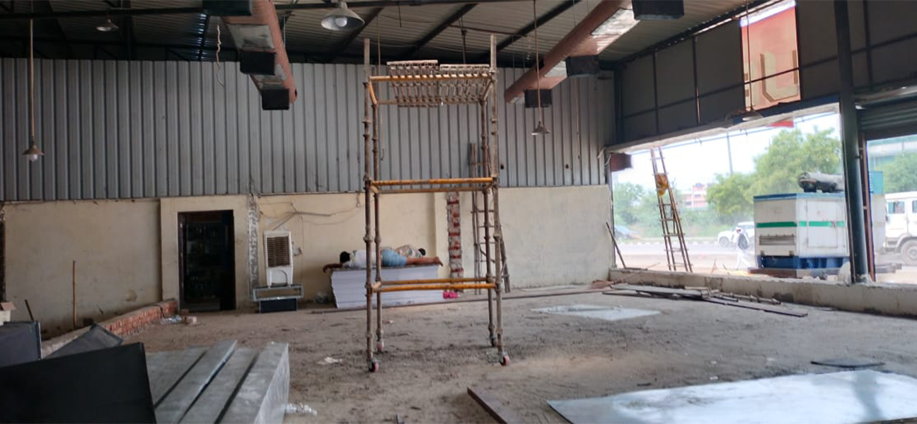 Woodnote Brand Shop Bahadurgarh retail liquor store interior by Next BC